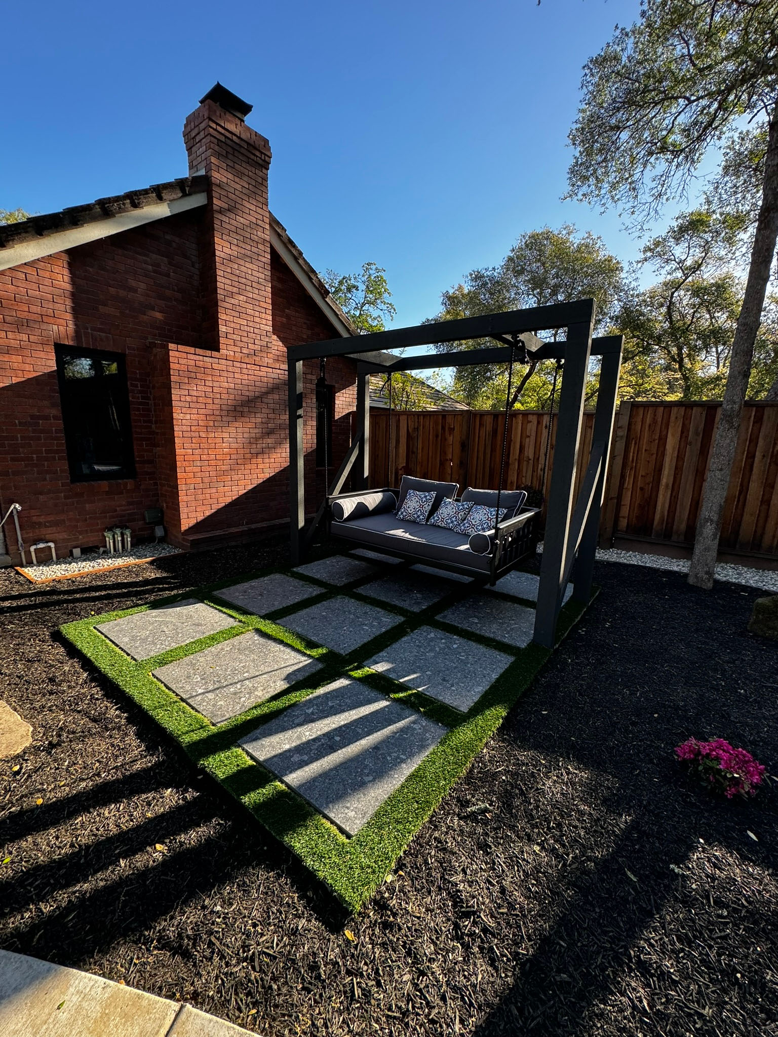 Elevated lounge with layered landscape lighting